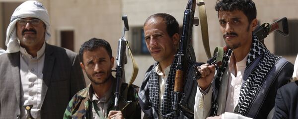 Shiite rebel fighters, known as Houthis, hold their weapons during a tribal gathering to show support for the Houthi movement in Sanaa, Yemen. Shiite rebel fighters, known as Houthis, hold their weapons during a tribal gathering to show support for the Houthi movement in Sanaa, Yemen. - Sputnik International