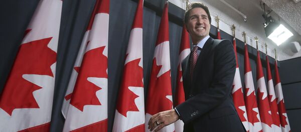 Canada's Liberal leader and Prime Minister-designate Justin Trudeau leaves at the conclusion of a news conference in Ottawa, Ontario, October 20, 2015 Canada's Liberal leader and Prime Minister-designate Justin Trudeau leaves at the conclusion of a news conference in Ottawa, Ontario, October 20, 2015 - Sputnik International