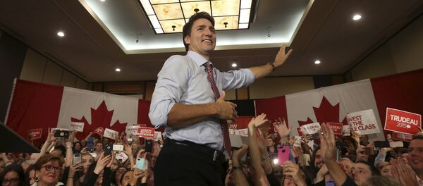 Liberal leader and Canada's Prime Minister-designate Justin Trudeau takes the stage during a rally in Ottawa, Ontario, October 20, 2015 Liberal leader and Canada's Prime Minister-designate Justin Trudeau takes the stage during a rally in Ottawa, Ontario, October 20, 2015 - Sputnik International