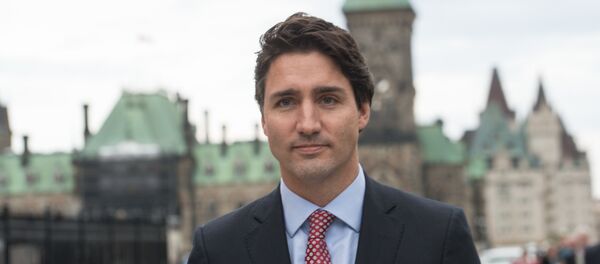 Canadian Liberal Party leader Justin Trudeau walks from the parliament to give a press conference in Ottawa on October 20, 2015 after winning the general elections Canadian Liberal Party leader Justin Trudeau walks from the parliament to give a press conference in Ottawa on October 20, 2015 after winning the general elections - Sputnik International