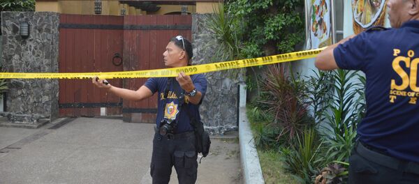 Police mark the crime scene with a yellow tape where two Chinese diplomats were killed in Cebu province, central Philippines on Wednesday Oct. 21, 2015 Police mark the crime scene with a yellow tape where two Chinese diplomats were killed in Cebu province, central Philippines on Wednesday Oct. 21, 2015 - Sputnik International