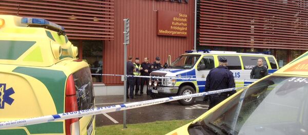Police cordon off an area after a masked man attacked people with a sword at a school in Trollhattan, western Sweden October 22, 2015 Police cordon off an area after a masked man attacked people with a sword at a school in Trollhattan, western Sweden October 22, 2015 - Sputnik International