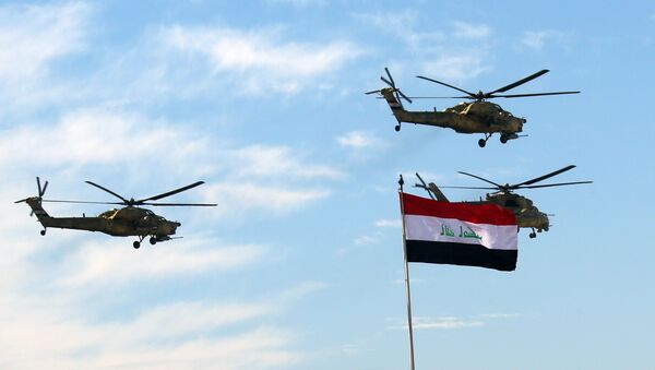 Iraqi Army helicopters fly in formation during the Army Day celebrations in Baghdad, Iraq, Tuesday, Jan. 6, 2015 - Sputnik International