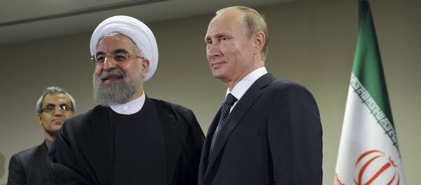 Russia's President Vladimir Putin (R) meets with Iran's President Hassan Rouhani on the sidelines of the United Nations General Assembly in New York, September 28, 2015 - Sputnik International