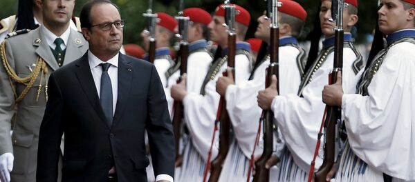 French President Francois Hollande inspects a guard of honour with his Greek counterpart Prokopis Pavlopoulos (not pictured) at a welcome ceremony in Athens, Greece, October 22, 2015. Hollande is paying a two-day official visit to Greece. French President Francois Hollande inspects a guard of honour with his Greek counterpart Prokopis Pavlopoulos (not pictured) at a welcome ceremony in Athens, Greece, October 22, 2015. Hollande is paying a two-day official visit to Greece. - Sputnik International