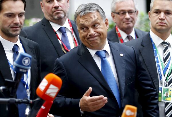 Hungary's Prime Minister Viktor Orban reacts as he arrives at a European Union leaders extraordinary summit on the migrant crisis, in Brussels, Belgium September 23, 2015. Hungary's Prime Minister Viktor Orban reacts as he arrives at a European Union leaders extraordinary summit on the migrant crisis, in Brussels, Belgium September 23, 2015. - Sputnik International
