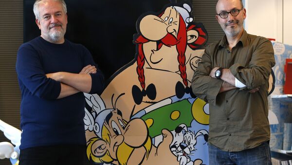 Author Jean-Yves Ferri (R) and illustrator Didier Conrad (L) pose next to cardboard cut-out of Obelix and Asterix in Vanves, near Paris, France, October 13, 2015 - Sputnik International