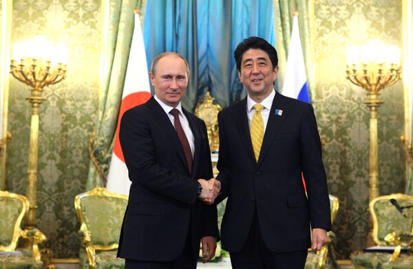 Russian President Vladimir Putin and Prime Minister of Japan Shinzo Abe shake hands prior to their talks in the Kremlin, April 29, 2013 Russian President Vladimir Putin and Prime Minister of Japan Shinzo Abe shake hands prior to their talks in the Kremlin, April 29, 2013 - Sputnik International