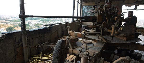 A soldier of the Syrian Arab Army is at an observation post facing the Jobar district occupied by terrorists A soldier of the Syrian Arab Army is at an observation post facing the Jobar district occupied by terrorists - Sputnik International