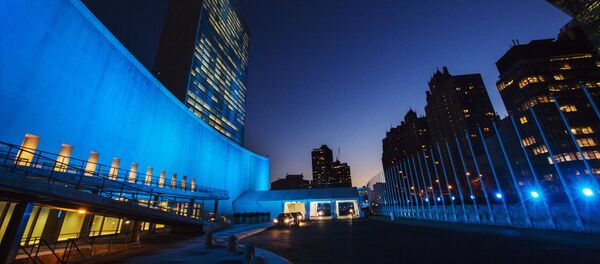 The United Nations headquarters is lit up in blue to honor the 70th anniversary of the United Nations in New York, October 23, 2015 - Sputnik International