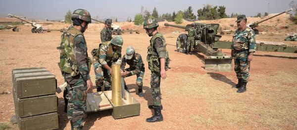 Crews of 130 mm guns of the 10th Division, 2nd Corps of the Syrian Arab Army are deployed off Katana, Damascus Province Crews of 130 mm guns of the 10th Division, 2nd Corps of the Syrian Arab Army are deployed off Katana, Damascus Province - Sputnik International