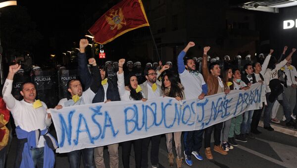 Montenegrin anti-government protesters carry a banner reading, Our future, our right during a protest in the capital Podgorica on October 24, 2015. - Sputnik International