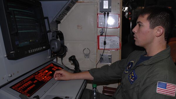 Naval Air Crewman (Operational Level) 2nd Class Roberto Hernandez, assigned to Patrol Squadron (VP) 9, analyzes sonobuoy information during a preflight check aboard a P-3 Orion aircraft at Misawa Air Base. VP-9 is on a deployment in the U.S. 7th Fleet area of responsibility. - Sputnik International