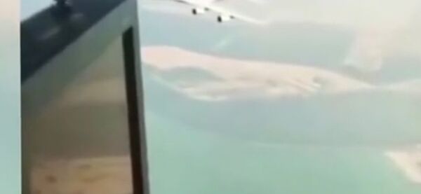 Incredible moment Emirates plane flies UNDERNEATH helicopter Incredible moment Emirates plane flies UNDERNEATH helicopter - Sputnik International