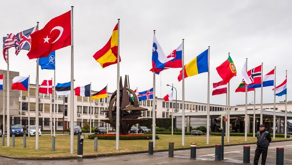 NATO country flags wave outside NATO headquarters in Brussels - Sputnik International