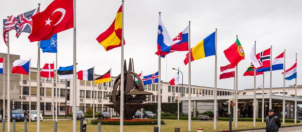 NATO country flags wave outside NATO headquarters in Brussels - Sputnik International