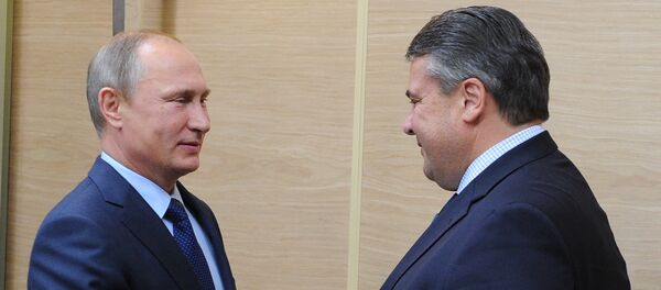 Russian President Vladimir Putin, left, and German Vice Chancellor and Minister for Economic Affairs and Energy Sigmar Gabriel during their meeting in Novo-Ogaryovo Russian President Vladimir Putin, left, and German Vice Chancellor and Minister for Economic Affairs and Energy Sigmar Gabriel during their meeting in Novo-Ogaryovo - Sputnik International