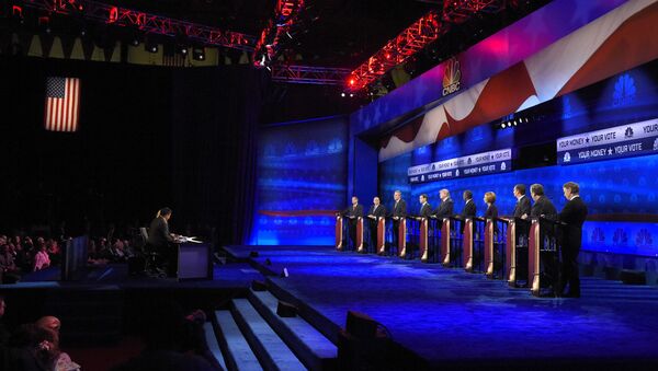 Republican presidential candidates, from left, John Kasich, Mike Huckabee, Jeb Bush, Marco Rubio, Donald Trump, Ben Carson, Carly Fiorina, Ted Cruz, Chris Christie, and Rand Paul take the stage during the CNBC Republican presidential debate at the University of Colorado, Wednesday, Oct. 28, 2015, in Boulder, Colo - Sputnik International