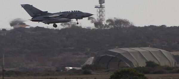 A warplane comes in to land after completed a mission at Britain's Royal Air Force Base in Akrotiri near southern city of Limassol, Cyprus, on Saturday, Sept. 27, 2014. Britain's Ministry of Defense said warplanes have taken off for their first combat mission over Iraq since Parliament approved airstrikes targeting the Islamic State group - Sputnik International