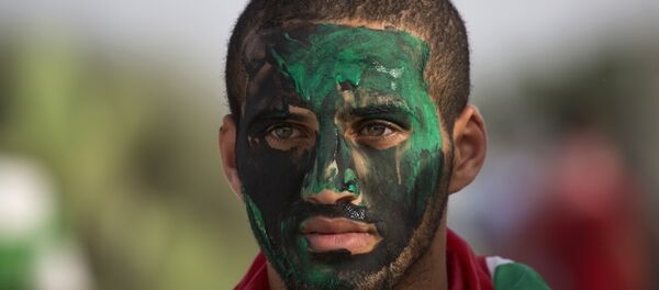 A Palestinain protester paints his face during clashes with Israeli solders during clashes at the Israeli border with Gaza east of Bureij refugee camp, central Gaza Strip, Friday, Oct. 23, 2015. A Palestinain protester paints his face during clashes with Israeli solders during clashes at the Israeli border with Gaza east of Bureij refugee camp, central Gaza Strip, Friday, Oct. 23, 2015. - Sputnik International