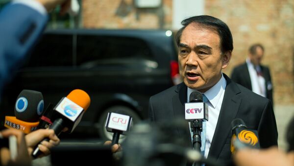 Chinese Deputy Foreign Minister Li Baodong addresses the media in front of the Palais Coburg Hotel, the venue of the nuclear talks in Vienna, Austria on June 28, 2015 - Sputnik International