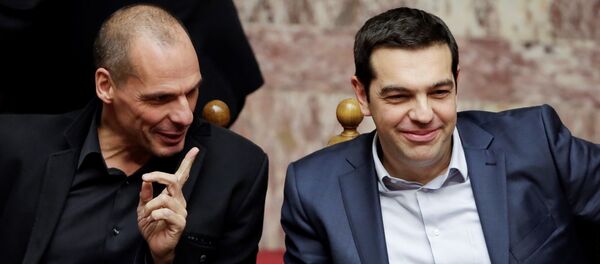 Greece's Prime Minister Alexis Tsipras, right, and Finance Minister Yanis Varoufakis chat during a Presidential vote in Athens, on Wednesday, Feb. 18, 2015. - Sputnik International