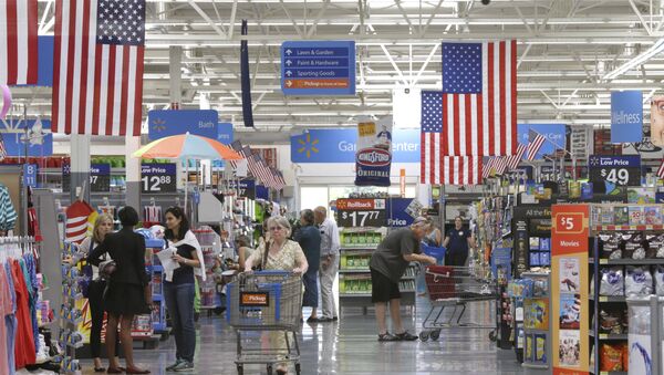 Customers shop on widened aisles at a Wal-Mart Supercenter store in Springdale, Ark., Thursday, June 4, 2015 - Sputnik International