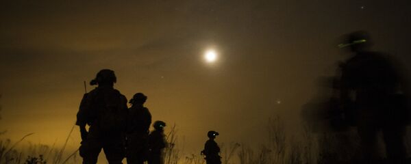 U.S. Army Soldiers from the 7th Special Forces Group prepare to leave the drop zone during fast rope insertion and extraction training as part of Emerald Warrior at Hurlburt Field, Fla., April 22, 2015. Emerald Warrior is the Department of Defense's only irregular warfare exercise, allowing joint and combined partners to train together and prepare for real-world contingency operations. U.S. Army Soldiers from the 7th Special Forces Group prepare to leave the drop zone during fast rope insertion and extraction training as part of Emerald Warrior at Hurlburt Field, Fla., April 22, 2015. Emerald Warrior is the Department of Defense's only irregular warfare exercise, allowing joint and combined partners to train together and prepare for real-world contingency operations. - Sputnik International
