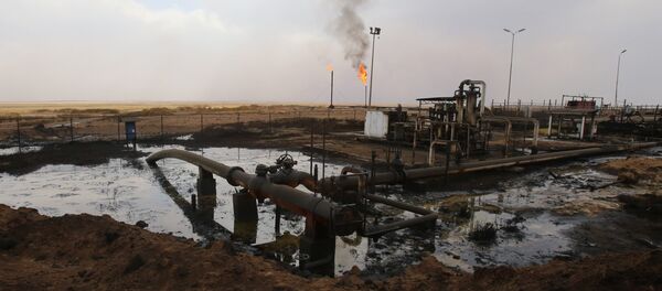 Oil well pumps are seen in the Rmeilane oil field in Syria's northerneastern Hasakeh province on July 15, 2015 Oil well pumps are seen in the Rmeilane oil field in Syria's northerneastern Hasakeh province on July 15, 2015 - Sputnik International