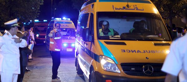 Police open the way for ambulances carrying the bodies of passengers of a Russian airliner which crashed in Sinai, into a morgue in Cairo, Egypt, October 31, 2015 - Sputnik International