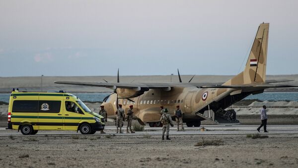 Egyptian ambulance waits at Kabret military air base by the Suez Canal on October 31, 2015, after victims of a Russian airliner that crashed in the Sinai Peninsula were brought to the base before being transported to a morgue. Egypt's government said 15 bodies have been recovered and transferred to a morgue so far from the site of the crash - Sputnik International