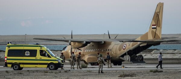 Egyptian ambulance waits at Kabret military air base by the Suez Canal on October 31, 2015, after victims of a Russian airliner that crashed in the Sinai Peninsula were brought to the base before being transported to a morgue. Egypt's government said 15 bodies have been recovered and transferred to a morgue so far from the site of the crash - Sputnik International