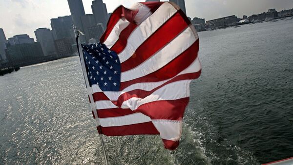 A United States flag flies on a ship of Massachusetts Bay Lines, Inc., against Boston skyline during Birth of A Nation Harbor Tours in Boston, Tuesday, July 11, 2006 - Sputnik International