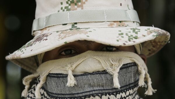 A Colombian Army Special Forces soldier waits to take part in a show of military exercises at the Tolemaida military base - Sputnik International