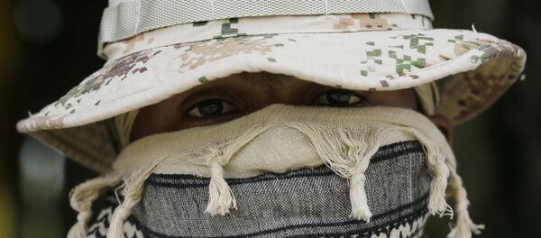 A Colombian Army Special Forces soldier waits to take part in a show of military exercises at the Tolemaida military base A Colombian Army Special Forces soldier waits to take part in a show of military exercises at the Tolemaida military base - Sputnik International
