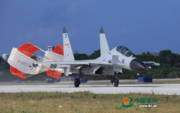 A J-11 fighter taxis on the runway after returning from a flight training on Oct. 30, 2015. An aviation division under the South China Sea Fleet of the Chinese PLA Navy carried out on Friday training on real air battle tactics. - Sputnik International
