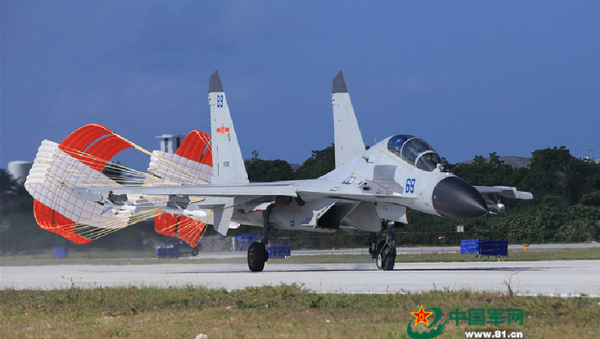A J-11 fighter taxis on the runway after returning from a flight training on Oct. 30, 2015. - Sputnik International