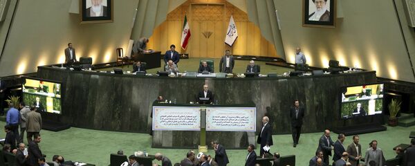 Head of Iran's Atomic Energy Organization Ali Akbar Salehi, center, speaks in an open session of parliament while discussing a bill on Iran's nuclear deal with world powers, in Tehran Head of Iran's Atomic Energy Organization Ali Akbar Salehi, center, speaks in an open session of parliament while discussing a bill on Iran's nuclear deal with world powers, in Tehran - Sputnik International