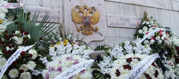 Flower wreaths near the Russian embassy in Damascus brought in memory of those who died in the crash of Kogalymavia Airlines' Airbus A321 plane (Flight 9268) en route from Sharm el-Sheikh to St. Petersburg - Sputnik International