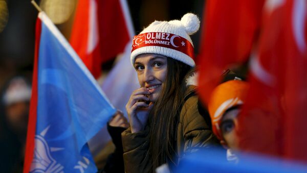 An AK Party supporter waits for the start of Turkey's Prime Minister Ahmet Davutoglu's speech in front of the party headquarters in Ankara, Turkey November 2, 2015. - Sputnik International