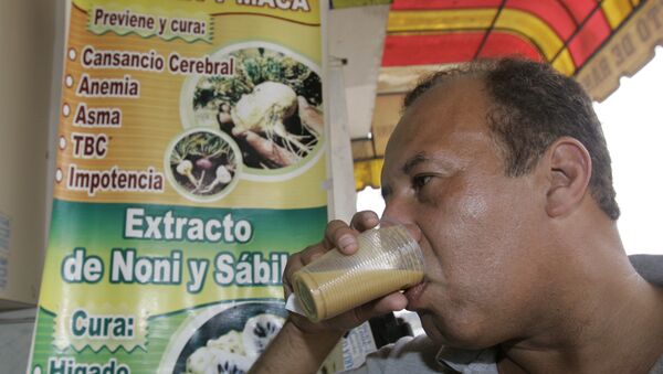 A man drinks a glass of frog juice in Lima, Peru. - Sputnik International
