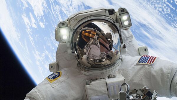 Astronaut Mike Hopkins, Expedition 38 Flight Engineer, is shown in this handout photo provided by NASA as he participates in the second of two spacewalks which took place on December 24, 2013 - Sputnik International