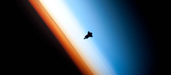 In a very unique setting over Earth's colorful horizon, the silhouette of the space shuttle Endeavour is featured in this photo by an Expedition 22 crew member on board the International Space Station, as the shuttle approached for its docking on Feb. 9 during the STS-130 mission. In a very unique setting over Earth's colorful horizon, the silhouette of the space shuttle Endeavour is featured in this photo by an Expedition 22 crew member on board the International Space Station, as the shuttle approached for its docking on Feb. 9 during the STS-130 mission. - Sputnik International