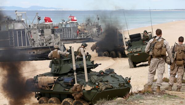 US marine armoured vehicles steers through the soft sand after getting off from a US Navy hovercraft during the NATO Trident Juncture exercise 2015 at Raposa Media beach in Pinheiro da Cruz, south of Lisbon, Tuesday, Oct. 20, 2015. - Sputnik International