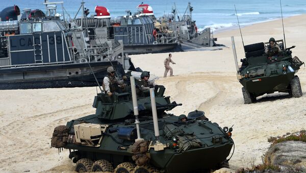 US marines disembark their armoured vehicles from the overcrafts deploid by the USS Arlington amphibious transport dock during the NATO's Trident Juncture exercise at Pinheiro da Cruz beach, south of Lisbon, near Grandola on October 20, 2015 - Sputnik International