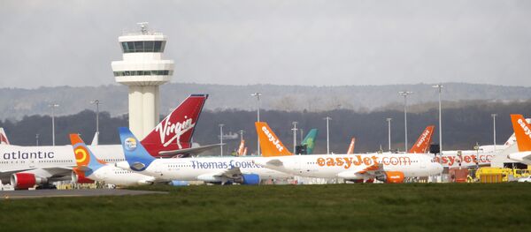 Airplanes stand idle at London's Gatwick Airport, England - Sputnik International