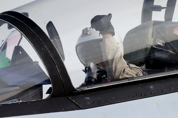 A pilot of a Sukhoi Su-30 fighter jet gestures before taking off at the Hmeymim air base near Latakia, Syria A pilot of a Sukhoi Su-30 fighter jet gestures before taking off at the Hmeymim air base near Latakia, Syria - Sputnik International