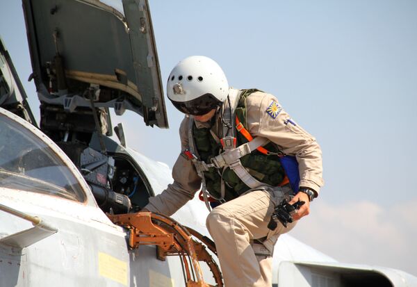 Russian pilot gets into a Su-24 aircraft before taking off at the Khmeimim airbase in Syria. File photo  - Sputnik International