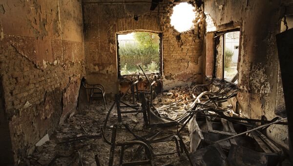 An interior view of the MSF Trauma Centre, 14 October 2015, shows a missile hole in the wall and the burnt-out remians of the the building aftera sustained attack on the facility in Kunduz, northern Afghanistan - Sputnik International