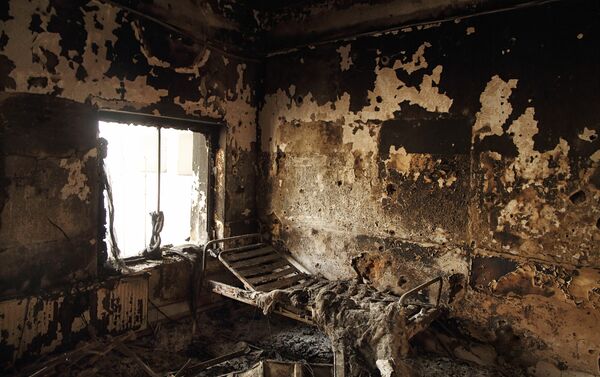 The remains of a bed frame in a room on eastern wing of the main Outpatient Department building - Sputnik International